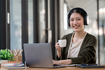 Hipster teen girl school student wear headphone watch video online webinar learn on laptop elearning course video conference pc call in library