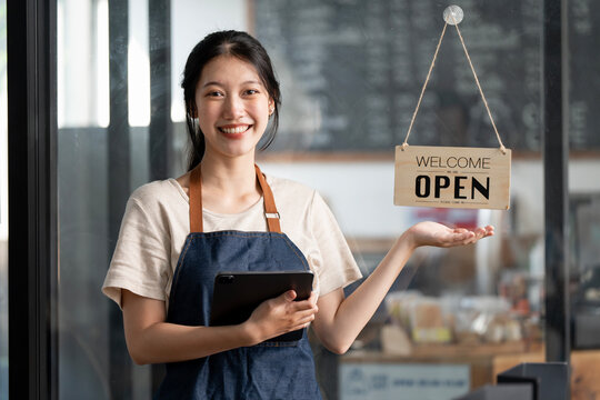 Startup successful small business owner sme beauty girl stand with arms crossed in coffee shop restaurant.