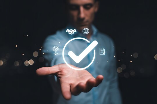 Achieving Success  A Man's Hand Presents a Digital Checkmark Symbol, Representing Completion, Approval, and Verification of Goals and Objectives