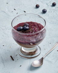 Lupin chocolate cream dessert with blueberry topping