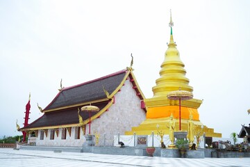 Golden Buddhist temples and ancient palaces in Thailand showcase beautiful Thai architecture and religious sculptures under clear skies.