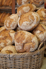 Freshly baked bread in a rustic basket at a bakery