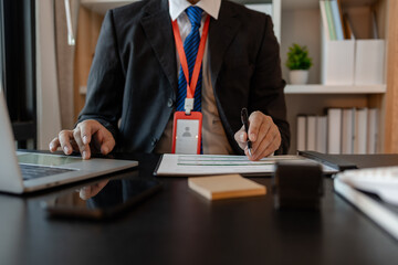 a businessman is reviewing accounting and financial statistics documents in his private office, the statistician prepares various charts and documents for a meeting