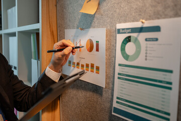 chart-based statistical data is prepared by accounting staff to present the company's income and expenditure data, a businessman prepares marketing and financial information for presentation