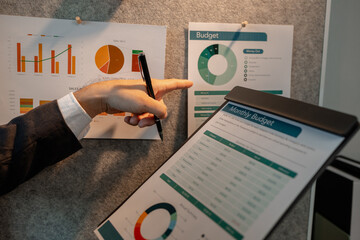 chart-based statistical data is prepared by accounting staff to present the company's income and expenditure data, a businessman prepares marketing and financial information for presentation