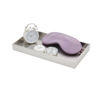 Sleek silver nightstand organizer tray featuring an alarm clock, sleep mask, and wireless charging pad for a tidy bedtime routine