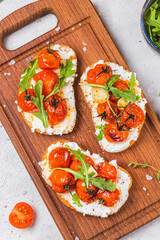 Bruschetta with ricotta and baked tomatoes