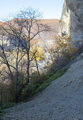 walks in the natural park in the autumn along the cliff cliff with panoramic views