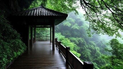Fototapeta premium Serene Pavilion Overlooking Lush Misty Mountain Landscape