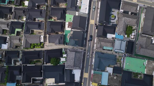 Tilt up the camera with a drone on Hwangridan-gil, a busy street where traditional houses in Gyeongju are gathered