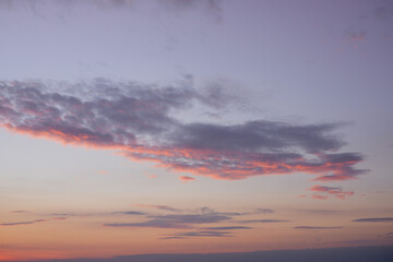 sunset in the sea. Beautiful colorful sky and cloud in twilight time background. Orange fluffy clouds and sun sunlight reflection in the blue