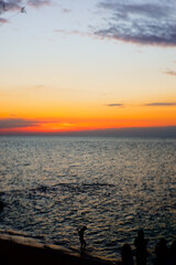 sunset in the sea. Beautiful colorful sky and cloud in twilight time background. Orange fluffy clouds and sun sunlight reflection in the blue
