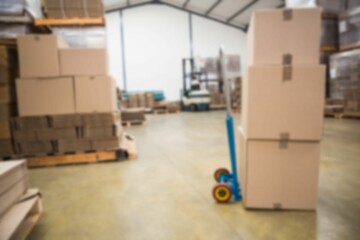 Cardboard boxes on fork lift in factory