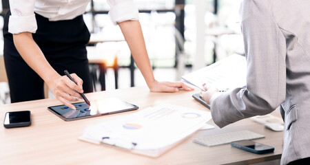 Business people  planning analyze investment and marketing on tablet in office.
