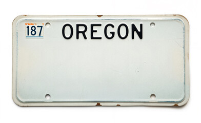 A vintage white Oregon license plate with bold black _OREGON_ text. Marked with "Text Space" sticker in the top left. Slightly weathered