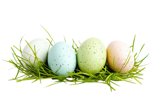 Set of three pastel colored easter eggs resting on green grass isolated on a transparent background