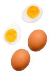 Top view set of two raw chicken eggs and cooked or boiled egg with egg yolk in two halves isolated on white background with clipping path