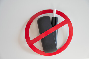 Prohibition sign on an electronic cigarette. Tobacco heating system. 