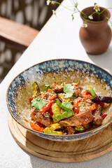 Beef and vegetable salad with cilantro, bright natural lighting, overhead composition