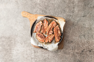 Whole pork belly grilled in an oven pan