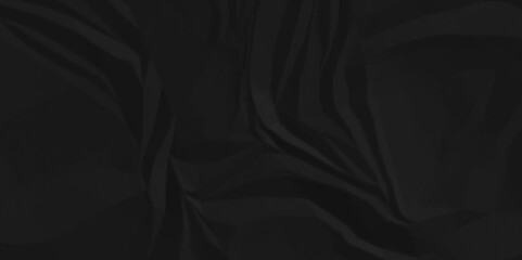 Dark black crumpled recycled craft paper texture background. Abstract blank background with space paper for text. Newspaper material wrinkled rough canvas paper texture.	