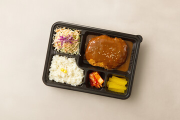 Various side dishes and hamburg steak lunch box