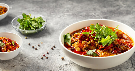 skewered vegetables and meat cooked in a hot and spicy soup