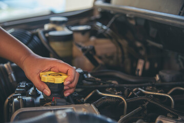 Close up Man hands fixing Car machinery vehicle mechanical service. Mechanic man hands repairing...