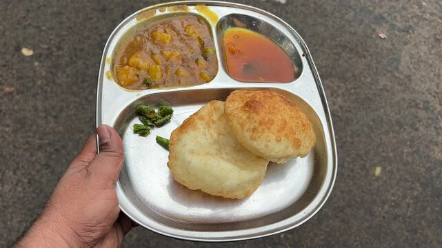 Kachori sabji chutney with spicy chilly in India.
