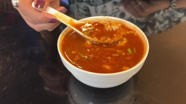 Egg chicken schezwan soup served in an Indian restaurant in Kolkata
