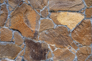 Texture of wall lined with natural stone. Template, background or wallpaper sample.