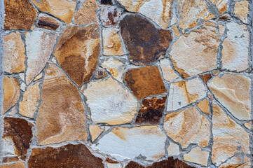 Texture of wall lined with natural stone. Template, background or wallpaper sample.