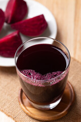 Fresh beetroot juice in glass on wooden board, Healthy drink