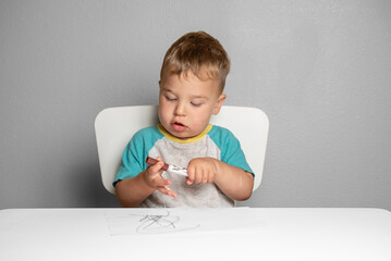 Toddler engaged in early creative exploration