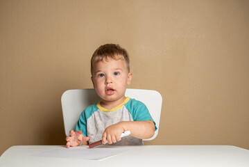 Toddler engaged in early creative exploration