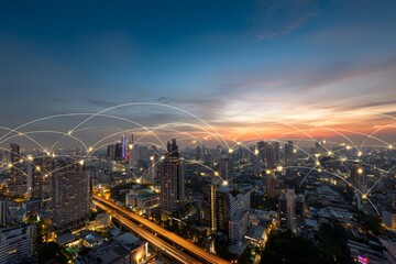 Fototapeta premium A wide shot of the Bangkok cityscape at sunset, with colorful light trails and digital lines connecting buildings across the horizon,