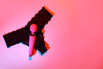 Vibrator with panties on red background
