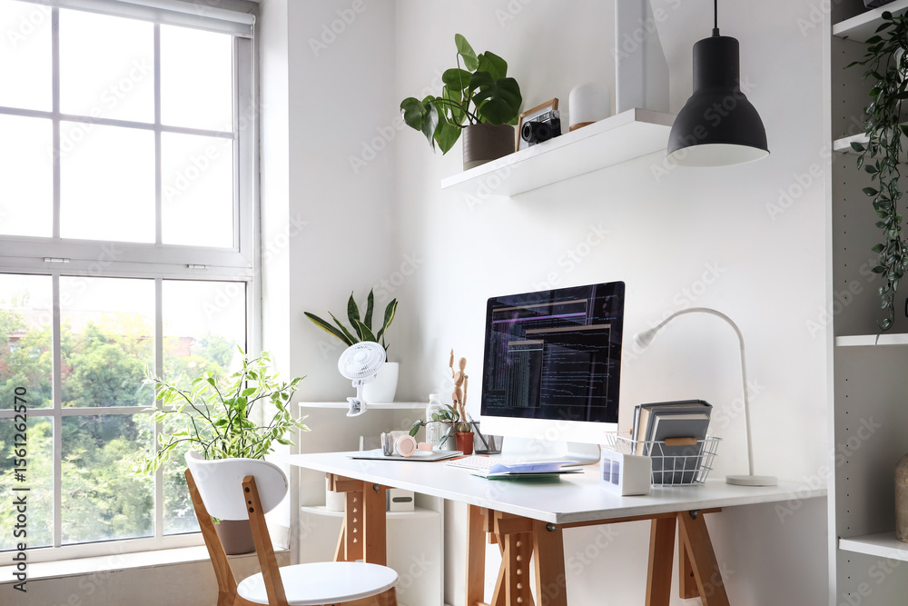 Wall mural programmer's workplace with computer in interior of light office