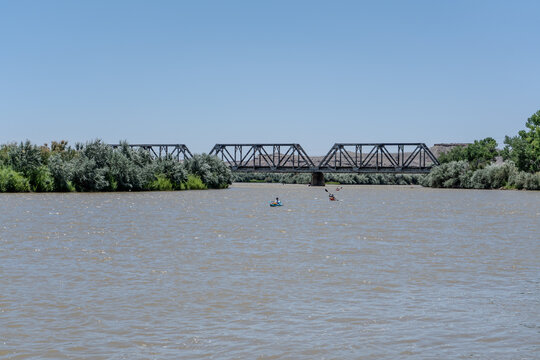Kayakers on the Green River Near Bridge in Utah