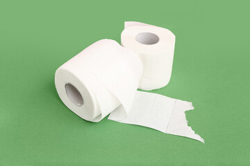 Rolls of toilet paper on colorful background