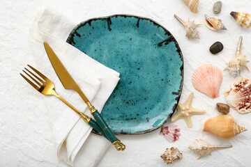 Beautiful table setting with marine decor on white background