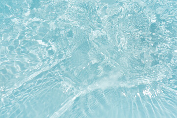 Blue water with ripples on the surface. Defocus blurred transparent blue colored clear calm water...