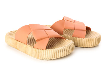 Orange female flip flops on white background