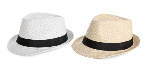Different stylish beach hats on white background