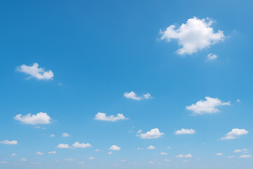 Serene Summer Sky: Blue Sky with Puffy White Clouds