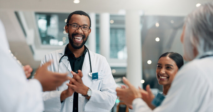 Healthcare, doctor and group with smile, applause and celebration for achievement, win and hospital. Happy, medical professional and people with success in clinic, victory and clapping for good news