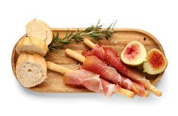 Wooden board of tasty Italian Grissini with prosciutto, bread and figs on white background
