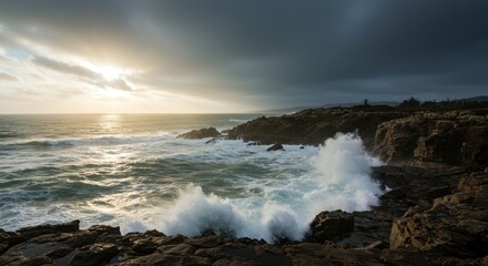 Obraz premium Dramatic coastal scene with waves crashing against rocky shoreline at sunset light