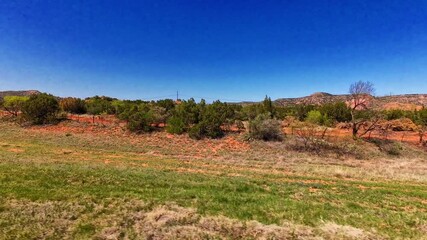 Texas Panhandle is characterized by dramatic canyon landforms, primarily due to the erosive power of rivers and wind over millions of years.