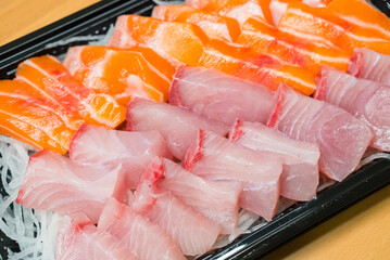 Fresh salmon and greater amberjack sashimi serving